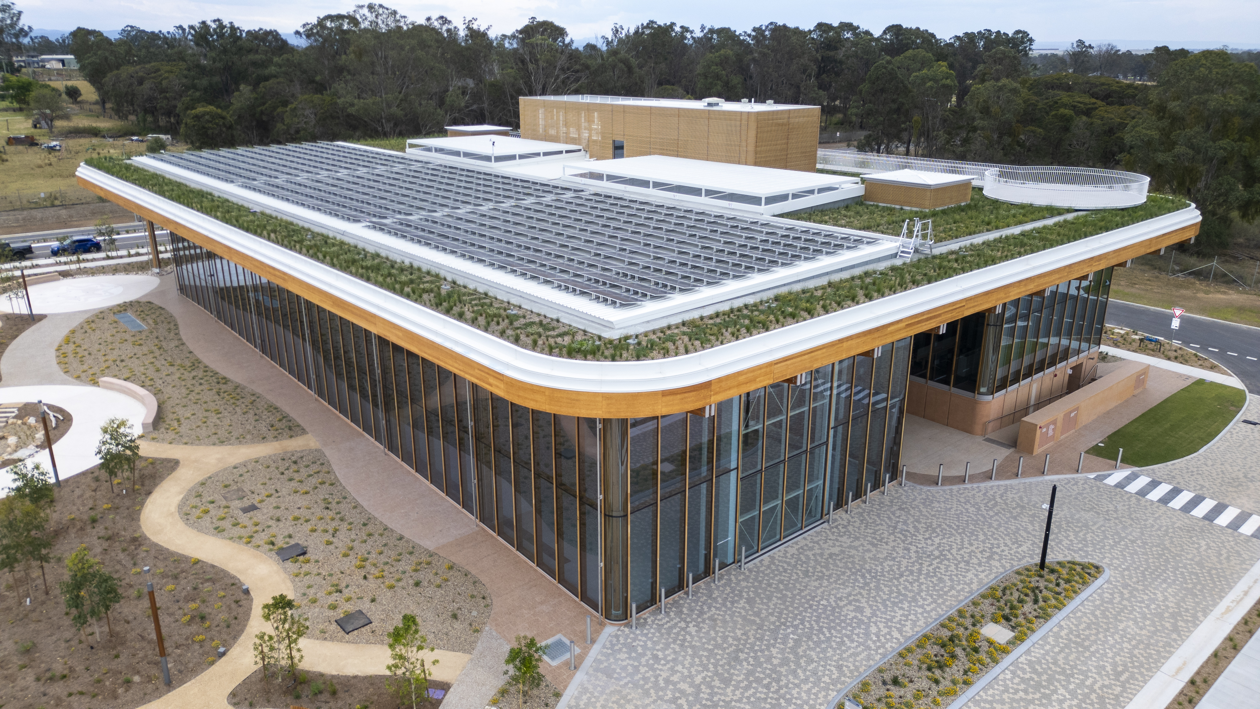 Aerial view of the First Building at Bradfield City with solar panels on roof.