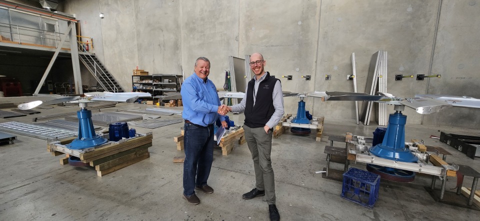 Gareth Jones, director of Marley Flow, and Ben Kitcher, Executive Director AMRF, shake hands..
