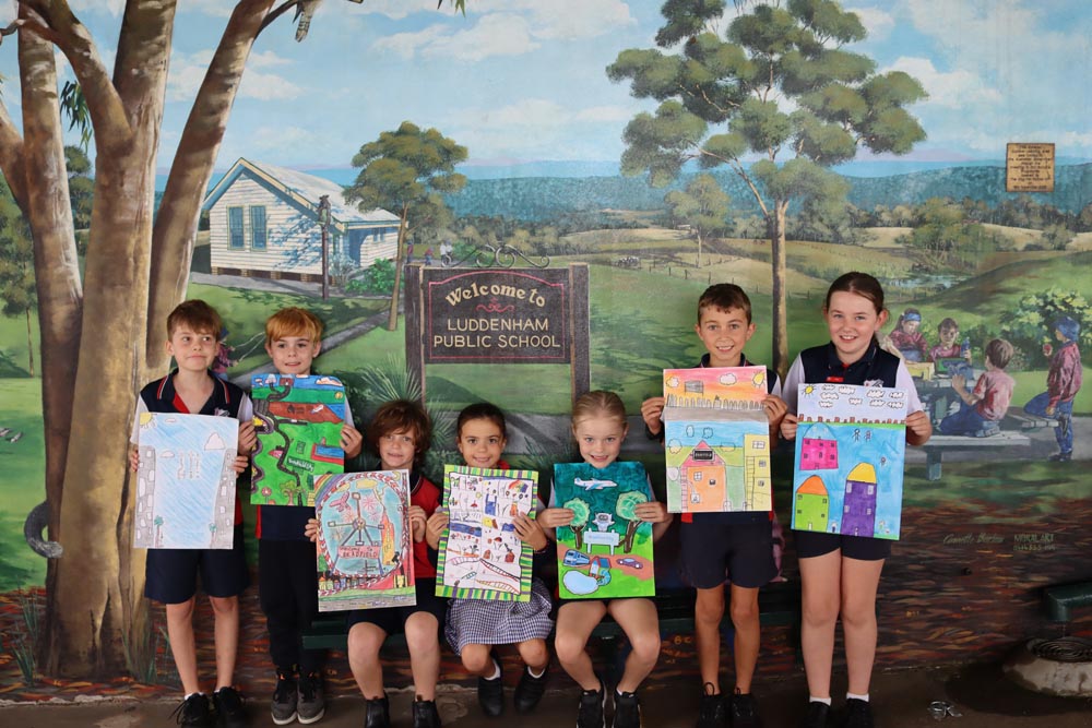 Children holding their artworks