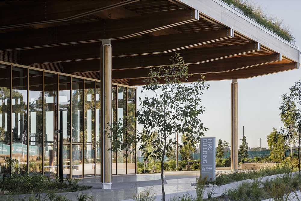 The entrance to a modern glass and timber building