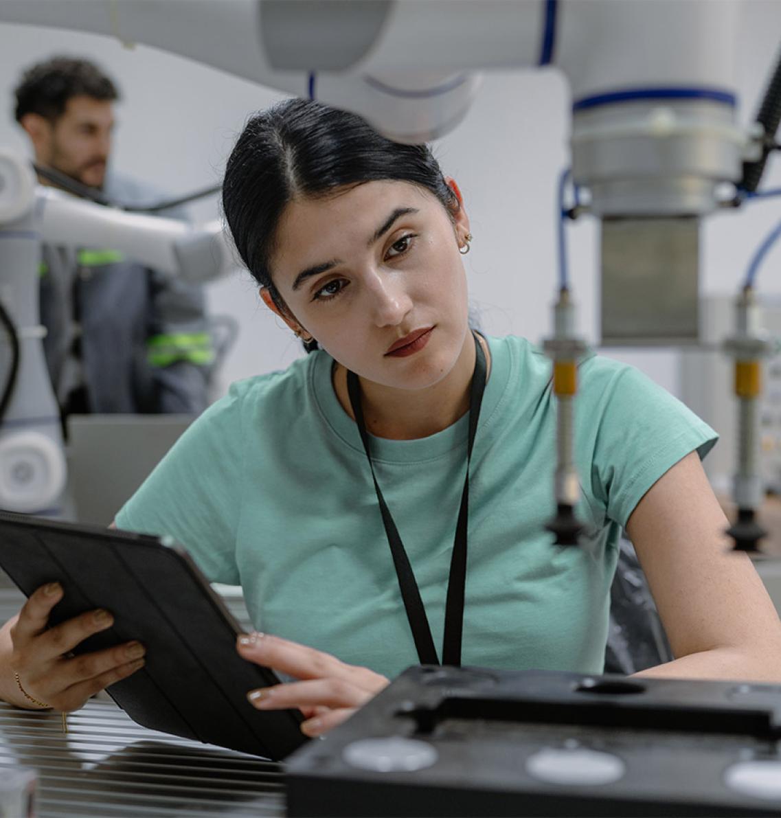 A researcher working with a robotic arm