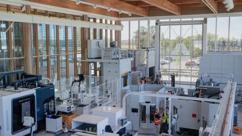 Machines and staff in the AMRF Manufacturing Hall