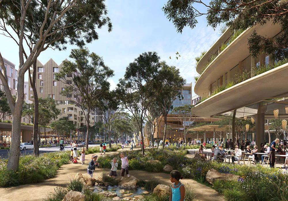 A tree lined city walking path surrounded by buildings