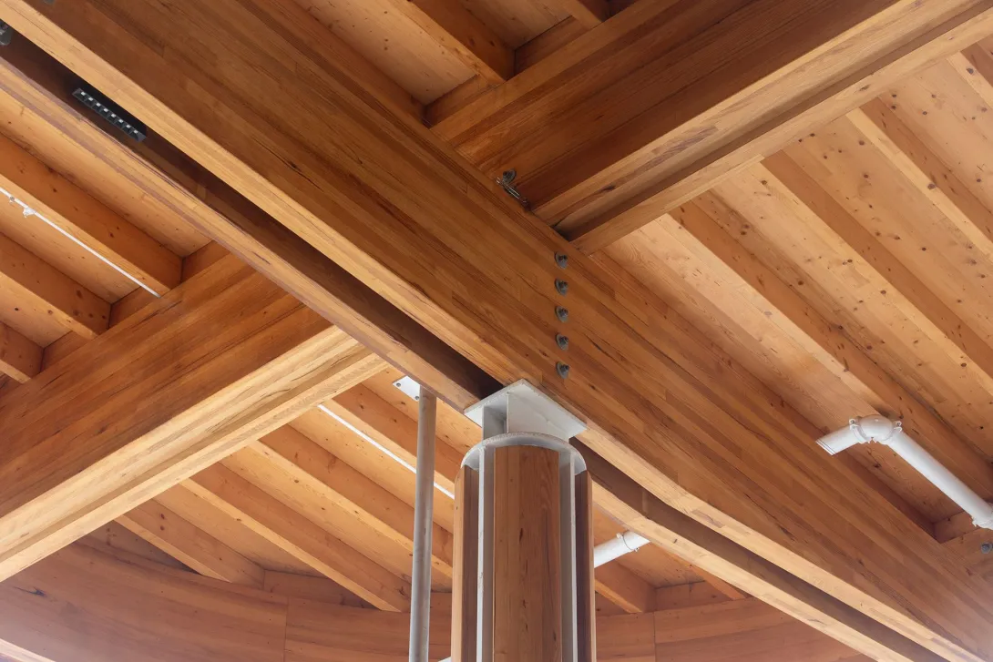 Underside of a timber roof supported by a column in the First Building
