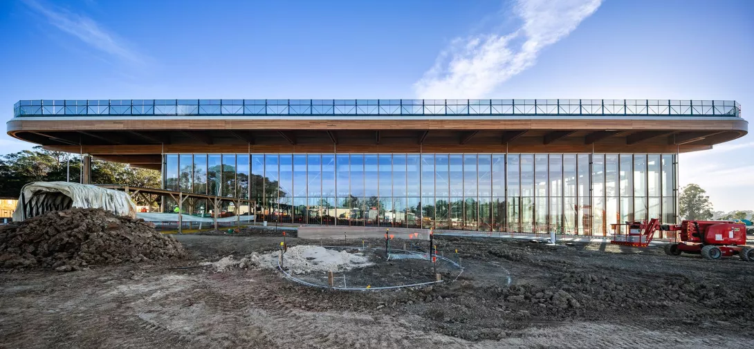 First Building and garden under construction showing installation of glass windows