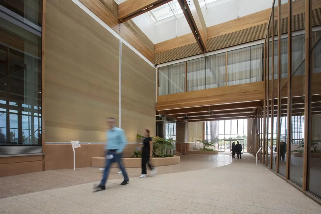 People walking through an atrium space