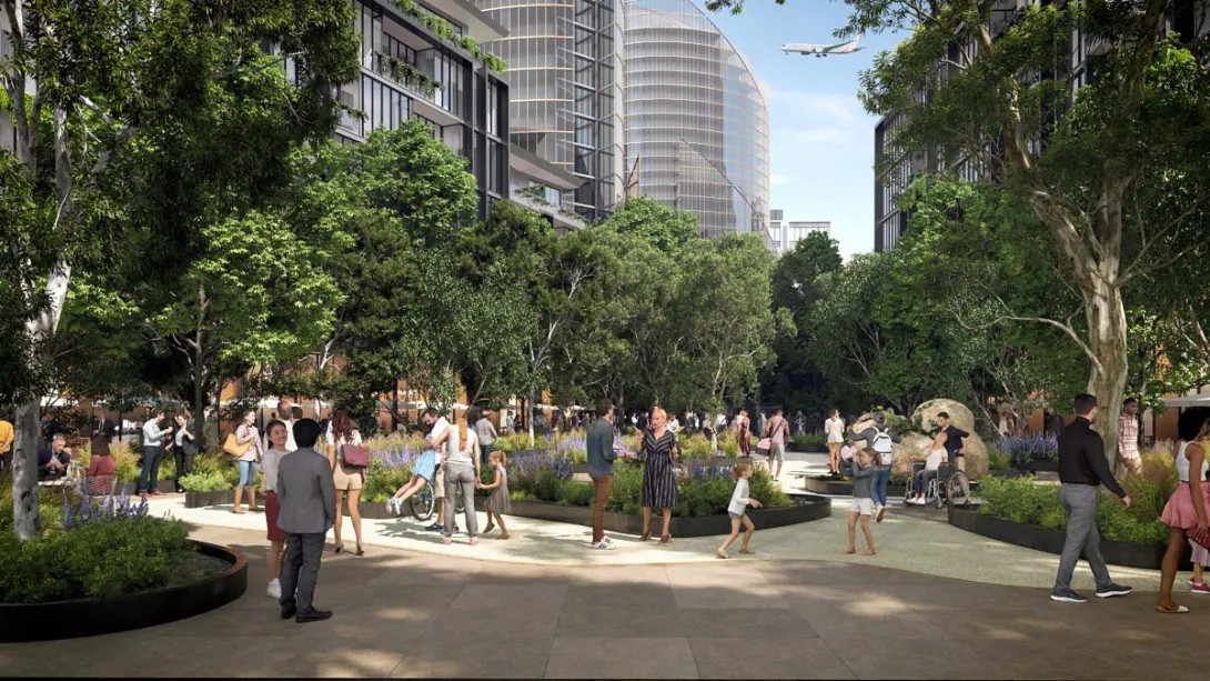 Pedestrians walking through a public green space