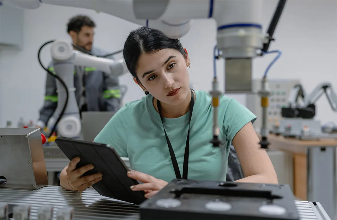 A researcher working with a robotic arm