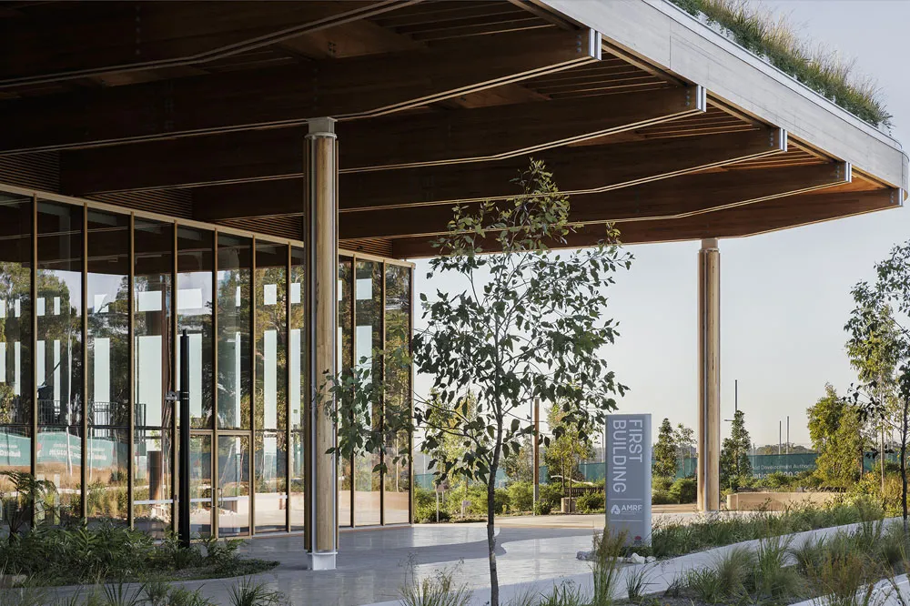 The entrance to a modern glass and timber building